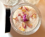 Island Rose Bath and Foot Soak in glass jar with rose petals and rosebud.