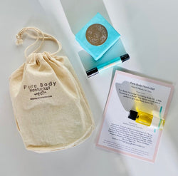 Gift Bag with mini body oil bottle on ingredient card, soap and lip conditioner.